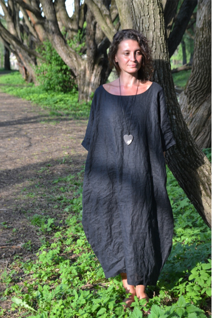 The dress is linen. A black designer hoodie made of linen. Boho style